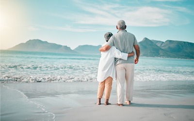 retired couple looking out over ocean